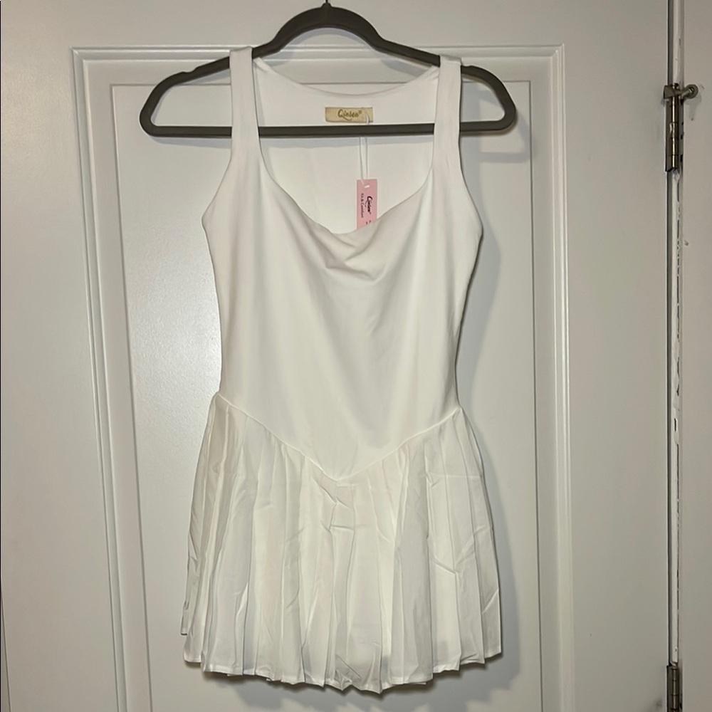 Brand new athletic dress with shorts and pockets